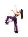 Attractive brunette girl with long hair dancing belly dance. Royalty Free Stock Photo