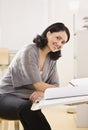 Attractive brunette woman drawing. Royalty Free Stock Photo