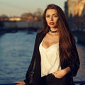 Attractive brunette woman posing against river on background Royalty Free Stock Photo