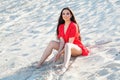 Attractive brunette woman with sea sand on beach Royalty Free Stock Photo