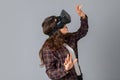 Attractive brunette woman testing virtual reality helmet Royalty Free Stock Photo