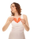 Attractive young girl holding broken paper red valentine heart Royalty Free Stock Photo