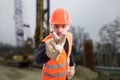 Attractive builder doing I`m watching you gesture Royalty Free Stock Photo