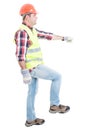 Attractive builder doing one step Royalty Free Stock Photo