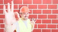 Attractive builder showing okay sign with happiness Royalty Free Stock Photo