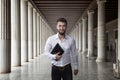 Attractive business man with a notebook in his hand Royalty Free Stock Photo