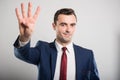 Attractive business man showing number four gesture Royalty Free Stock Photo