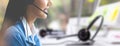 Attractive business woman Asian in suits and headsets are smiling while working with computer at office. Customer service Royalty Free Stock Photo