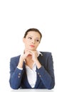 Attractive business woman proping her head, sitting. Royalty Free Stock Photo