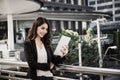 Attractive business woman using a digital tablet while standing in front of office Royalty Free Stock Photo