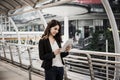 Attractive business woman using a digital tablet while standing in front of office Royalty Free Stock Photo