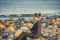 Attractive business woman working on laptop at beach Royalty Free Stock Photo