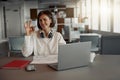 Attractive business woman working laptop while sitting in cozy cafe and showing sign ok Royalty Free Stock Photo