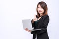 Business woman holding laptop standing on isolated white background. Portrait of beautiful young girl showing Royalty Free Stock Photo