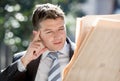 Attractive businessman sitting outdoors in breakfast pause early morning reading newspaper news looking relaxed Royalty Free Stock Photo