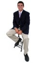 Attractive Businessman Sitting On Stool