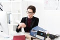 Attractive businesswoman checking time at wristwatch Royalty Free Stock Photo