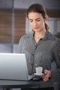 Attractive businesswoman having coffee-break