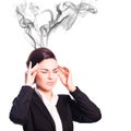 Attractive businesswoman with headache symbolized by smoke