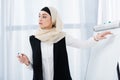 attractive businesswoman in hijab pointing at white board during meeting Royalty Free Stock Photo