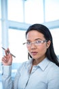 Attractive businesswoman holding pen Royalty Free Stock Photo