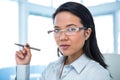 Attractive businesswoman holding pen Royalty Free Stock Photo