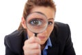 Attractive businesswoman holds magnifying glass