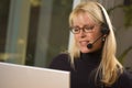 Attractive Businesswoman with Phone Headset