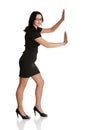 Attractive businesswoman push imaginary wall