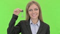 Attractive Businesswoman Showing Key against Chroma Key Royalty Free Stock Photo