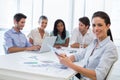 Attractive businesswoman smiling in business meeting Royalty Free Stock Photo