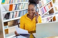 Attractive businesswoman, speaking on the phone, African American woman at training seminar, female business leader going true Royalty Free Stock Photo