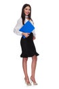 Attractive businesswoman standing and holding a blue clipboard Royalty Free Stock Photo