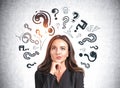 Attractive businesswoman wearing formal suit is standing touching her chin Royalty Free Stock Photo