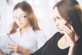 Attractive businesswomen talking on phone Royalty Free Stock Photo