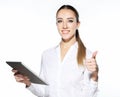 Attractive businnes woman using tablet showing thumbs up.