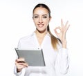 Attractive businnes woman using tablet showing thumbs up.