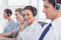 Attractive call centre agent with a headset Royalty Free Stock Photo