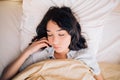 Young beautiful woman sleeping in bed, relaxing in the morning Royalty Free Stock Photo