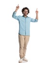 attractive casual man pointing fingers up Royalty Free Stock Photo