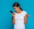 Attractive casual woman screaming at the phone Royalty Free Stock Photo