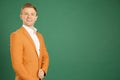 Attractive caucasian adult male wearing orange jacket