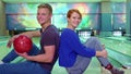 Boy and girl show their thumbs up at the bowling