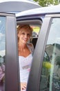 Attractive caucasian bride sitting in car Royalty Free Stock Photo