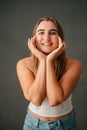 Attractive Caucasian female framing her face with her hands Royalty Free Stock Photo