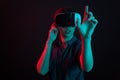 Attractive caucasian woman amazed in studio with virtual reality helmet. Royalty Free Stock Photo