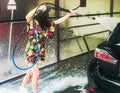 Independentwoman wash car aggressively Royalty Free Stock Photo