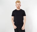 Attractive caucasian young man wearing a blank cotton black t-shirt isolated on white, man in blank tshirt mock up