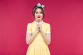 Attractive charming young woman in yellow dress standing