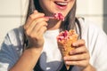 Portrait of happy caucasian brunette woman, eating ice-cream cone.